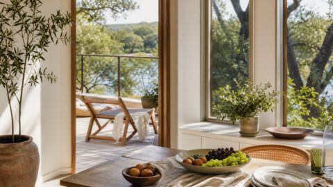 Simple summer outdoor table with fresh fruit, towels, sunshine, and a relaxed family-at-home feeling.