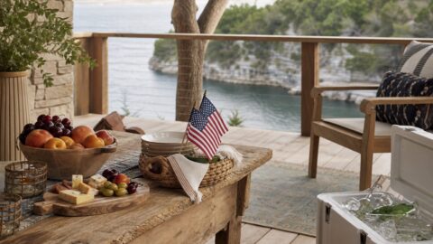Lake Travis-inspired summer setting with limestone cove feeling, fruit, simple snacks, ice chest detail, small patriotic decor, and natural light.